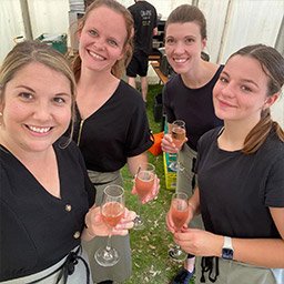Crab Apple Catering Team at a Dorset Event Crab Apple Catering team smiling together at an outdoor event in Dorset